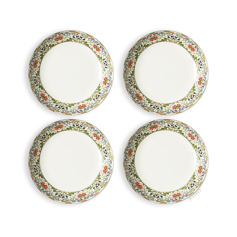 Set of four 8" bone china meal plates in grid arrangement on white.