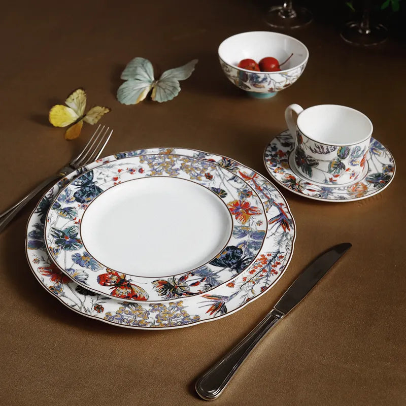 Place setting: stacked plates, bowl with hawthorn, cup/saucer with cutlery.