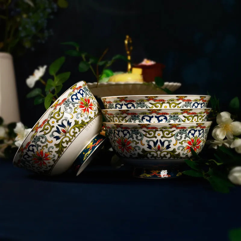 Stacked bowls with side-leaning bowl showing enamel and translucent china on blue cloth.