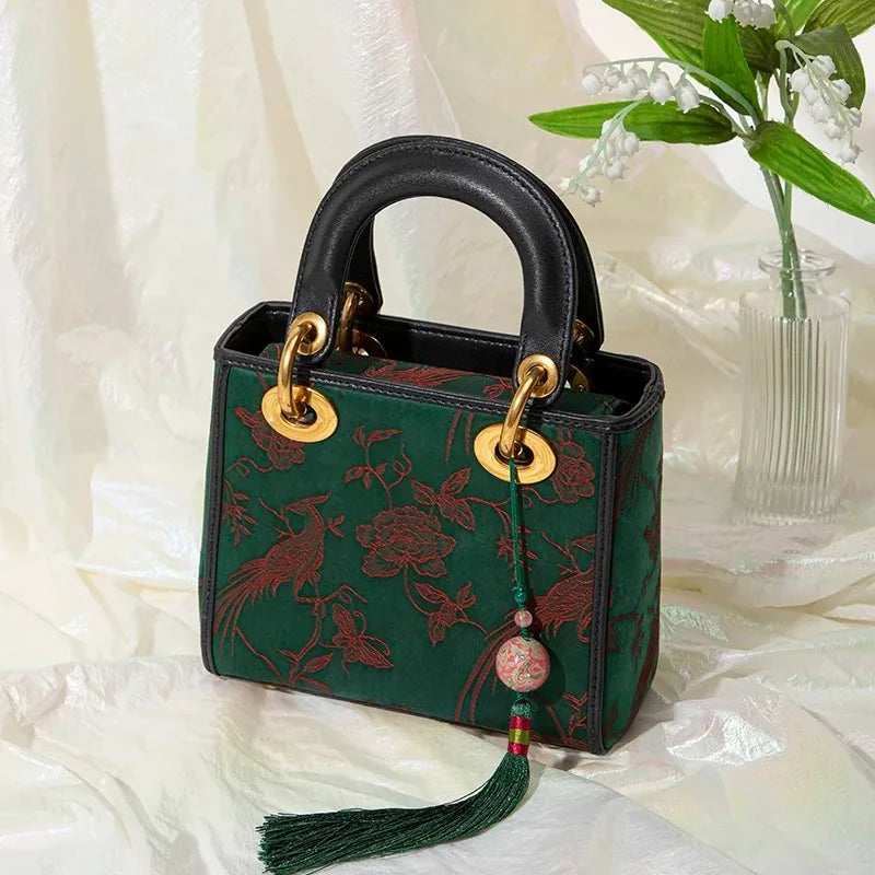 Xiangyunsha Silk Green Retro Cowhide Handbag with Pendant - SinoCultural