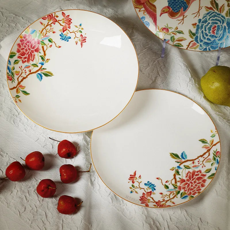 Overlapping plates, top view, showing floral design of Chinoiserie bone china.
