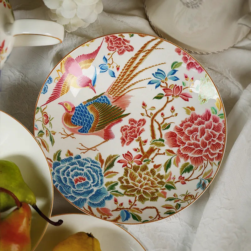 Top view of 9’’ round bone china salad plate with white floral decor and a pear.