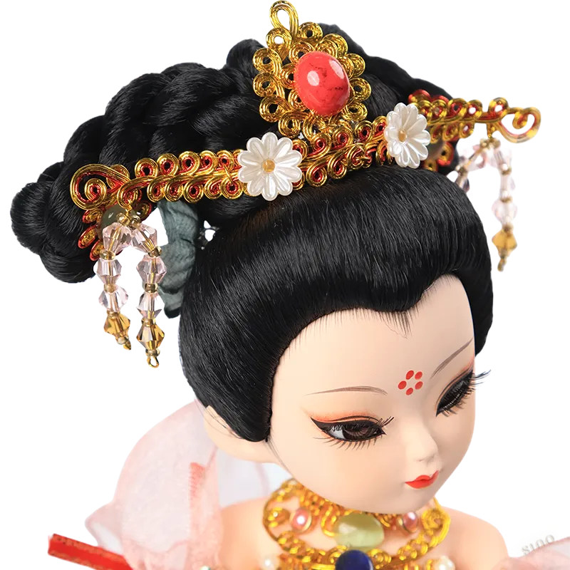 Detail of 9-inch Dunhuang doll's golden headdress with red gem, pearl, and flower accents.