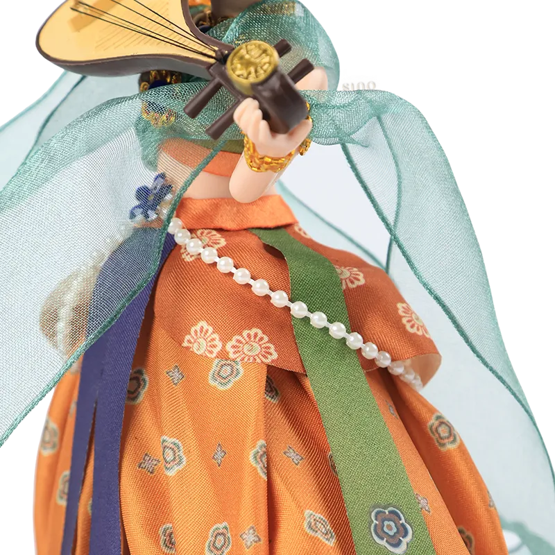 Left body outfit detail of 9-inch Dunhuang "Pipa Dance" doll with floral patterns.