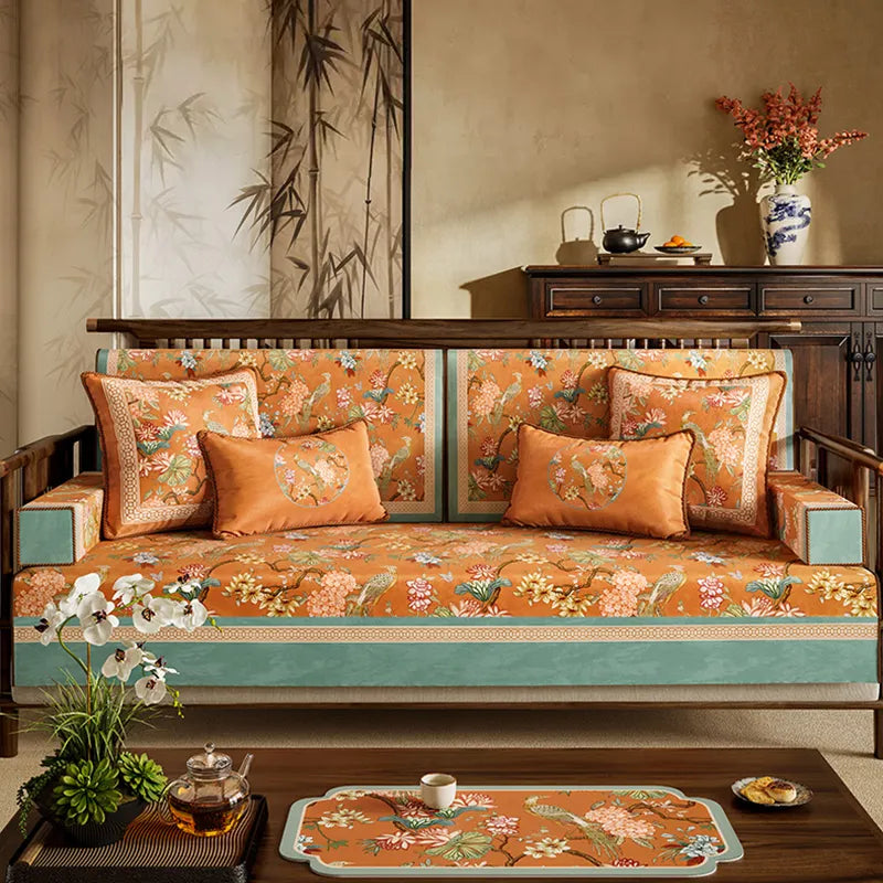 Vintage orange sofa protective pad with mountain, bird and hydrangea motif.