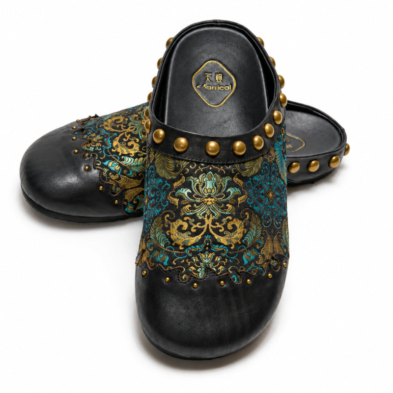 Top view of black women’s mules showcasing Ancient Leaf brocade pattern and slip-on style.