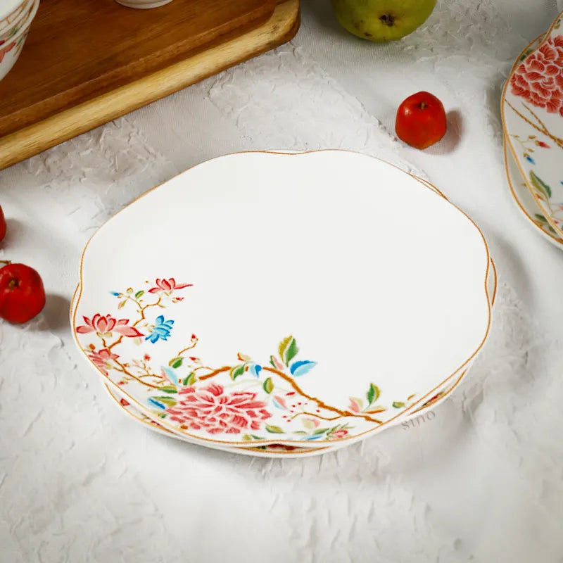 Single square chinoiserie plate on table, 45-degree angle showing depth.