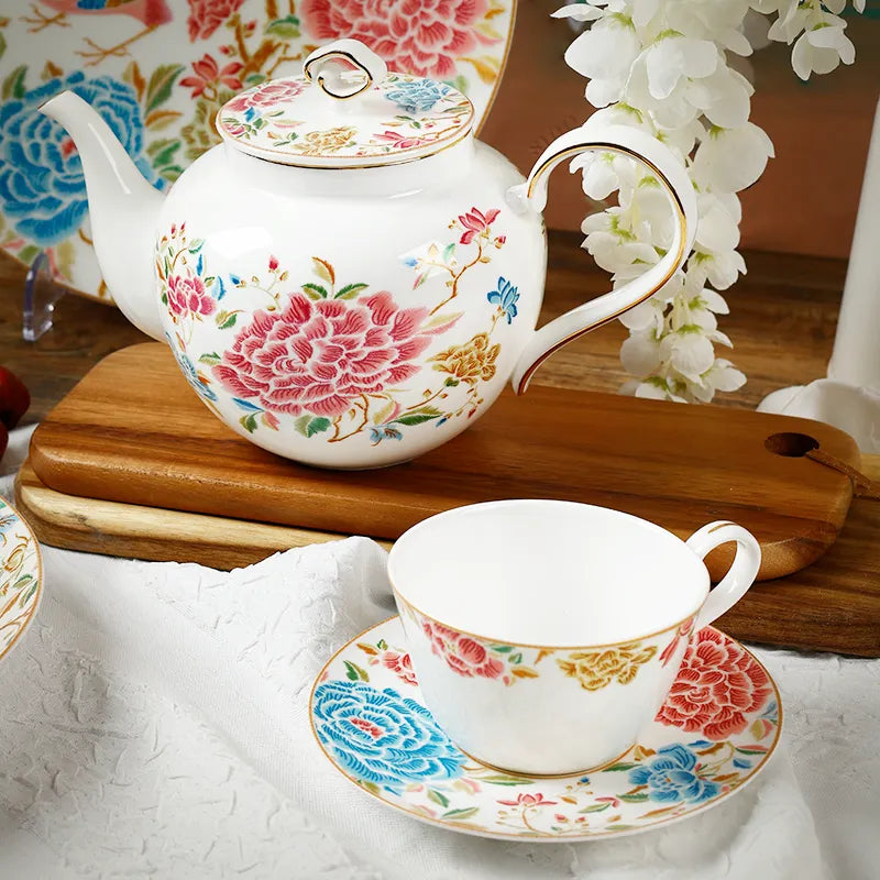 Angled view of floral tea set onAngled view of floral tea set on wooden display board.