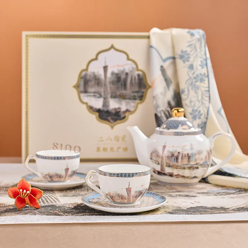 Bone china tea set gift box with teapot, two tea cups, silk scarf, and brooch in Pearl River Skyline design.