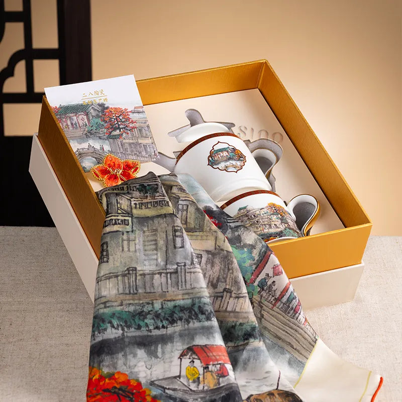 Open gift box with bone china tea set and silk scarf in Liwan Lake Vista design.