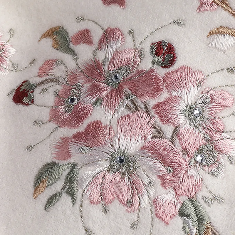 Hand-stitched camellia flower embroidery on cashmere scarf.