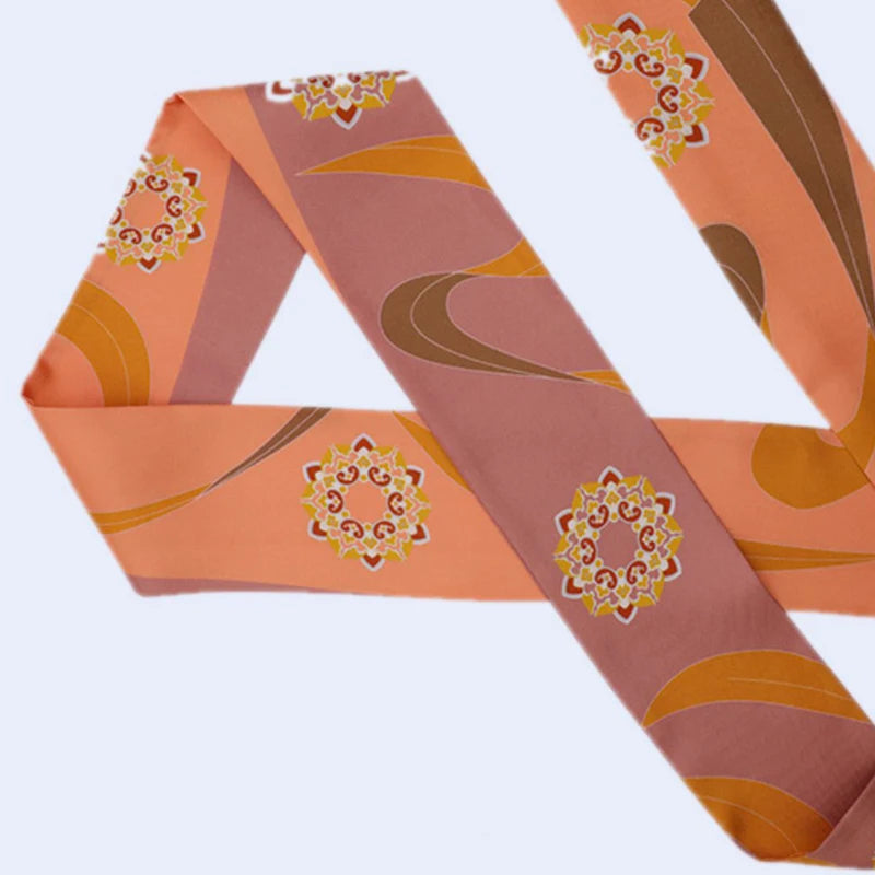 Chinese Dunhuang Motif Print Mulberry Silk Twilly 160x7.3 cm in a close flat detail view showing orange geometric flow and Dunhuang motif elements.