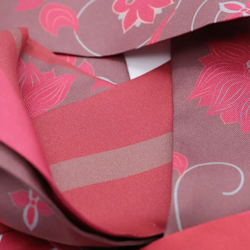 Close-up detail of the Chinese Dunhuang Motif Print Mulberry Silk Twilly 160x7.3 cm showing pink stripe accents and refined printed silk fabric.