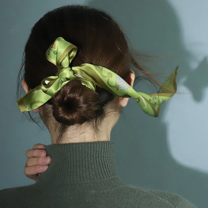 Back view of the Chinese Grape Vine Print Mulberry Silk Twilly tied around a bun, highlighting its graceful styling effect.