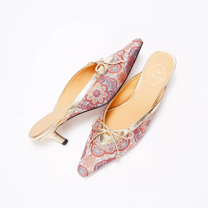 Detailed view of Chinese-inspired Song Brocade kitten heel mules featuring traditional floral craftsmanship.