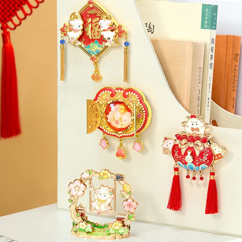 Four 2027 Year of the Goat fridge magnets displayed on a cream-colored board, featuring auspicious sheep designs and festive Chinese New Year decorations.