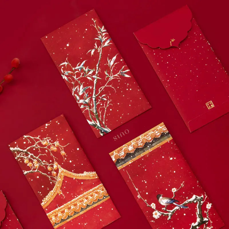 Hand holding three Chinese New Year hongbao designs featuring snowy plum blossoms, bamboo branches, colorful birds, and traditional Chinese roof patterns.