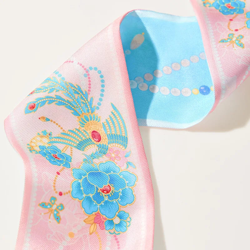 Close-up of phoenix, blue peony and jeweled motifs on the Chinese Mulberry Silk Twilly.