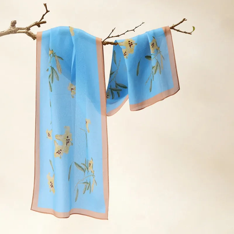 Blue Lily Chinese Poetic Blossom Print Mulberry Silk Long Scarf 140x32 cm with yellow lily and green leaf motifs.