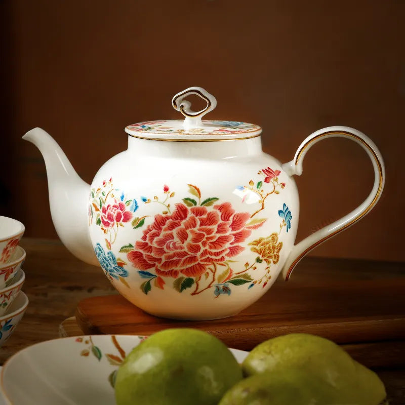 420ml chinoiserie teapot flat on table with pear decoration, floral design.