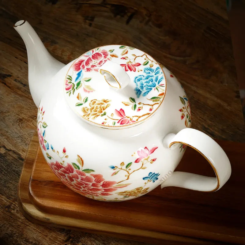 Top view of 420ml chinoiserie teapot on table showing lid detail, floral design.