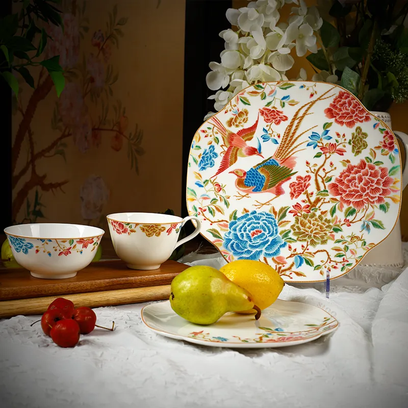 Chinoiserie bone china set scene: 11" square plate vertical, 8" square plate flat with pears, bowl and teacup on side.