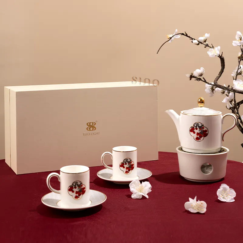 Chinoiserie bone china tea set gift box with teapot, two tea cups, and two saucers in bird and red berry motif.