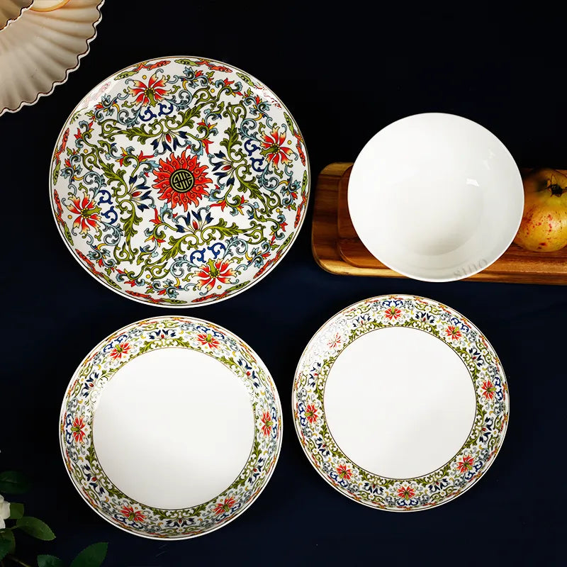 Overhead view: 10" plate, 8" plates and footed bowl showcasing enamel artwork.