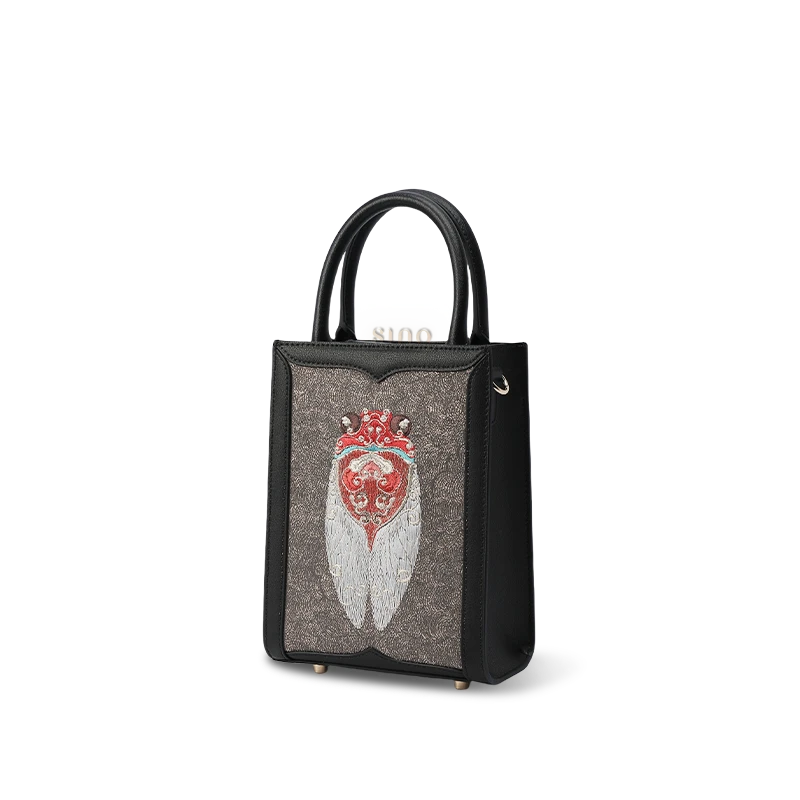 Side profile showing bag depth and leather handles.