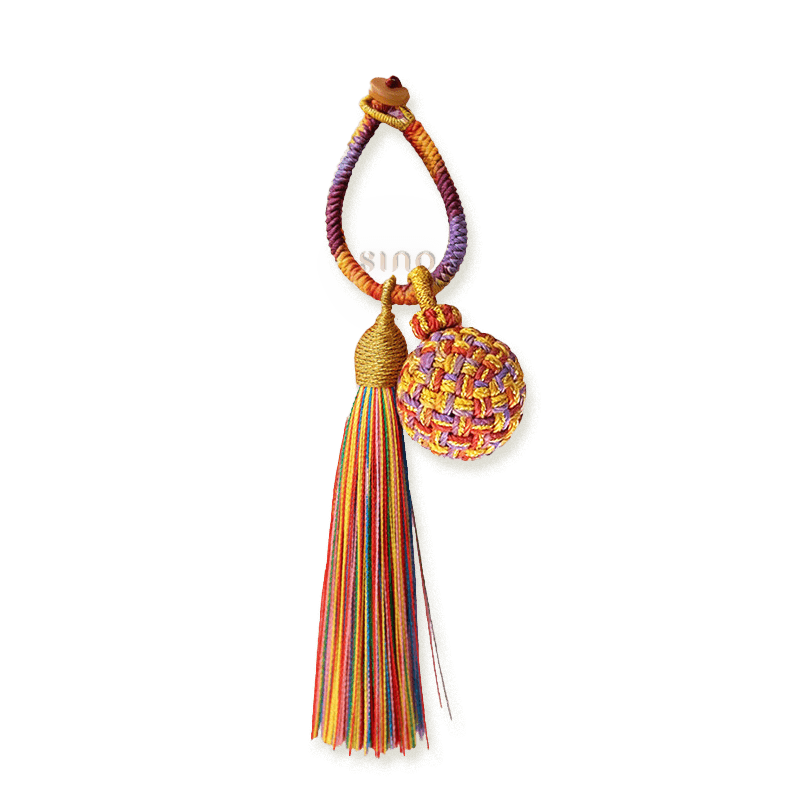 Handmade Fire Fortune Ball bag charm with a multicolor woven ball, braided hanging loop, and long rainbow tassel.
