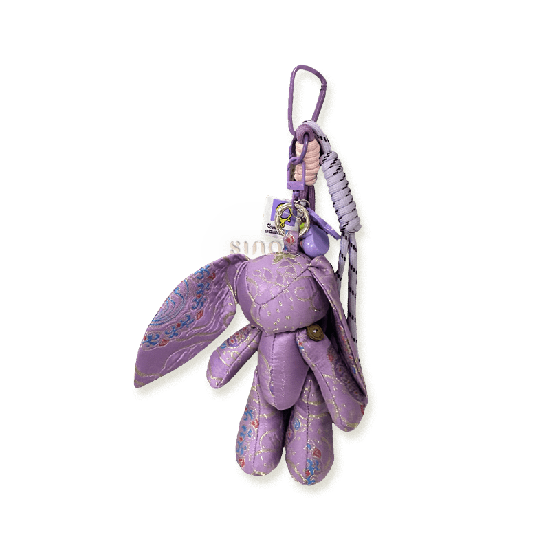 Purple Jade Rabbit bag charm handcrafted from Yunjin brocade with long ears, a braided hanging loop, and auspicious Chinese-style details.
