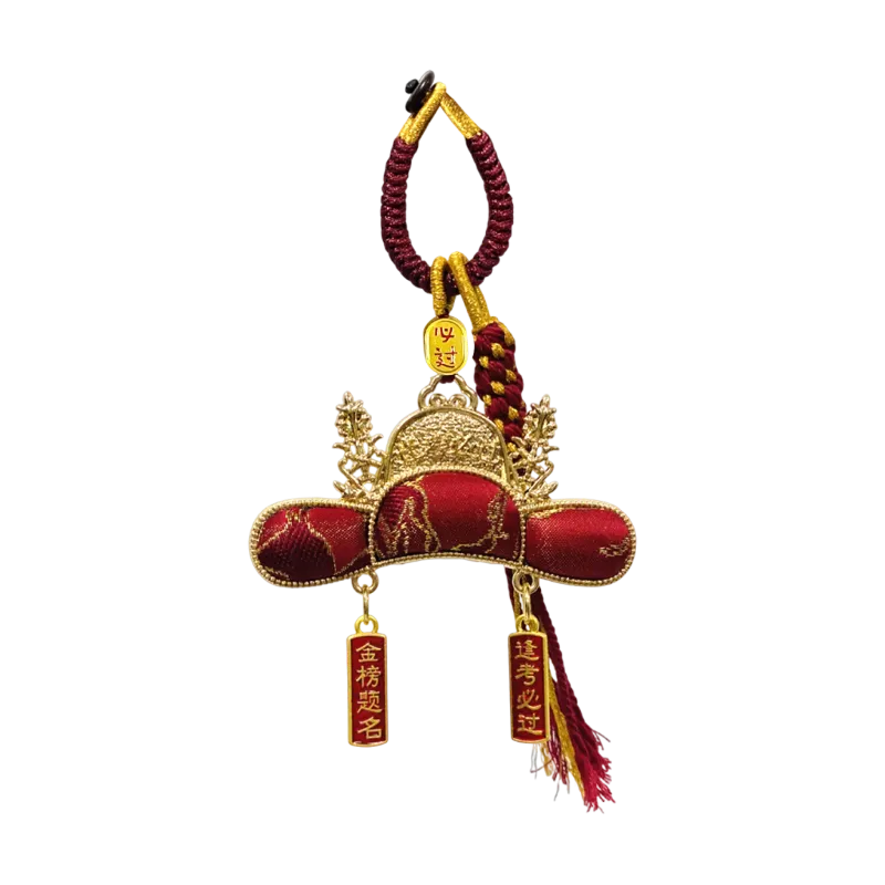 Chinoiserie Imperial Scholar Hat Bag Charm crafted with Nanjing Yunjin brocade, featuring red and gold tassels and symbolic exam blessings for “Pass Every Exam” and “Achieve Top Honors.”