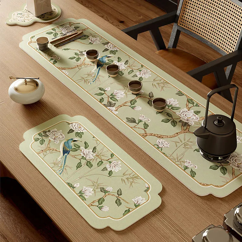 Angled view of Style A tea mat leather placemat with teacup and tea tray on top.