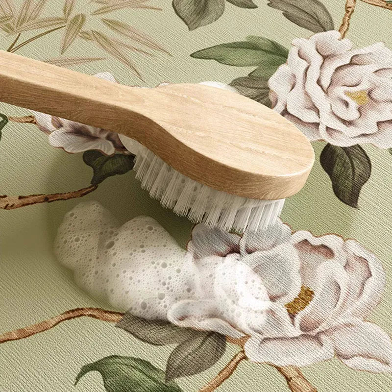 Wipe-clean performance of waterproof jade green leather placemat for tea and dining.