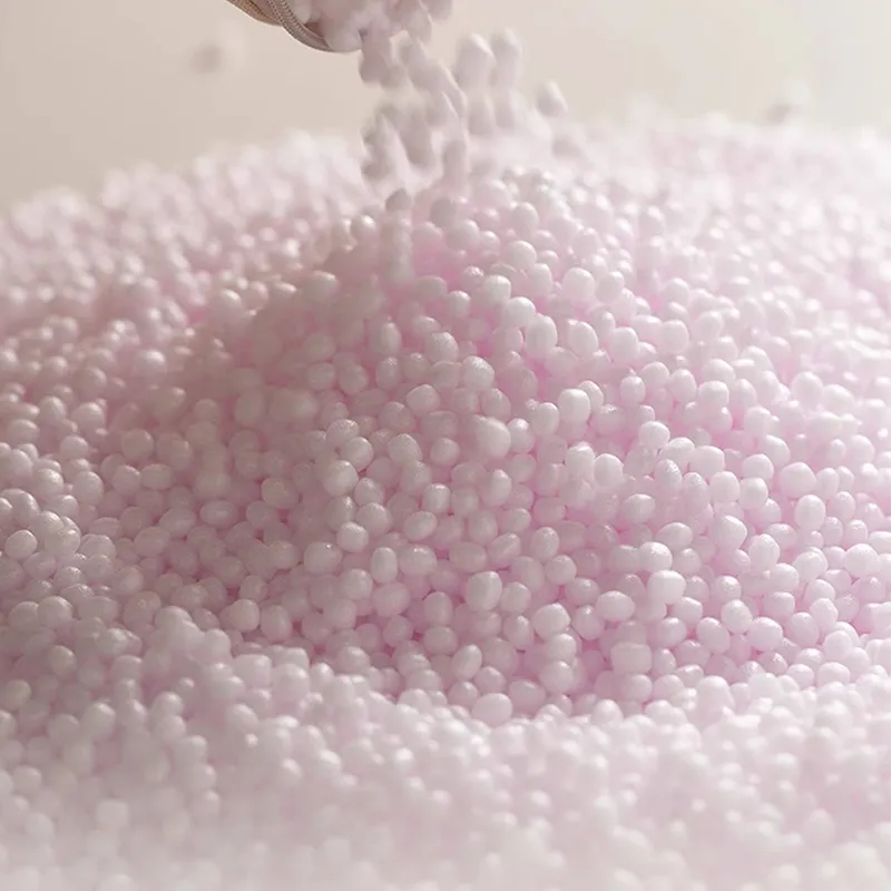 Detail view of abundant eco-friendly foam bead filling inside the floor pouf for a soft, supportive feel.