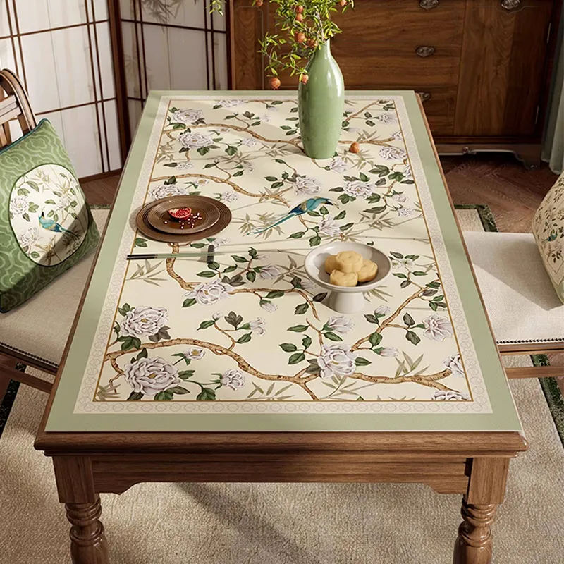 Style A jade green chinoiserie rectangular leather table mat laid flat on dining table, top view.