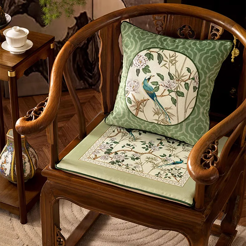 Front view of Style A jade green chair cushion styled with matching chinoiserie throw pillow.