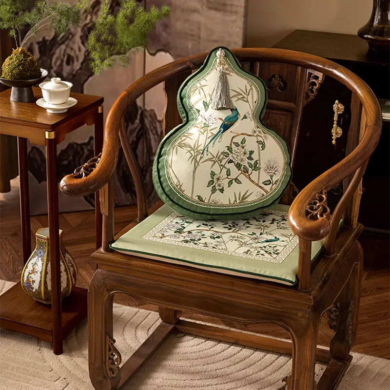 Style A jade green short plush chair cushion on chair with gourd-shaped pillow as a chinoiserie decor accent.