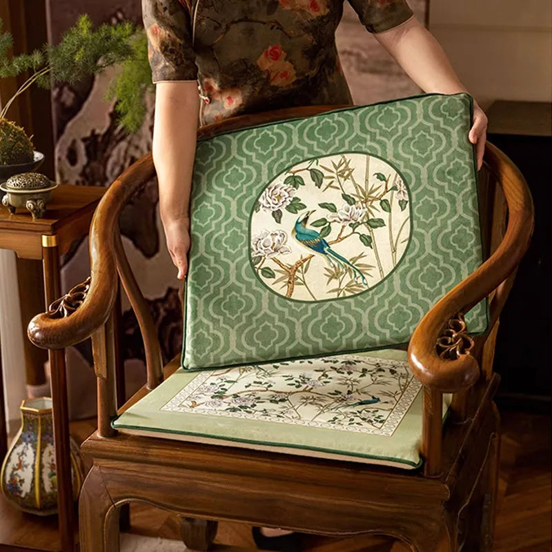 Style A chinoiserie jade green short plush chair cushion on chair, with model holding Style B to place on the backrest.