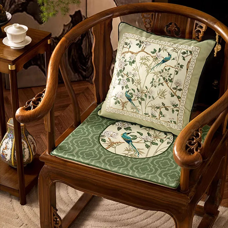 Front view of Style B jade green chair cushion styled with matching chinoiserie throw pillow.