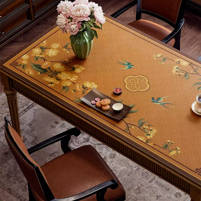 Left floral swallow pattern and leather texture on rectangular table.