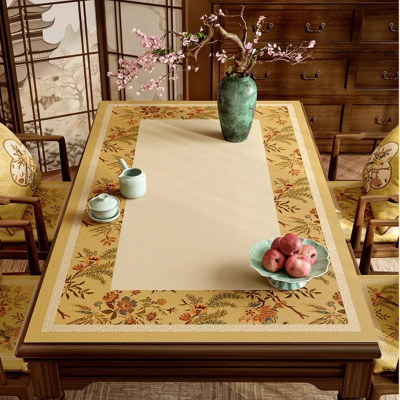 Autumn Splendor leather dining table mat styled with tea ware, fruit and floral Chinoiserie accents for everyday dining.
