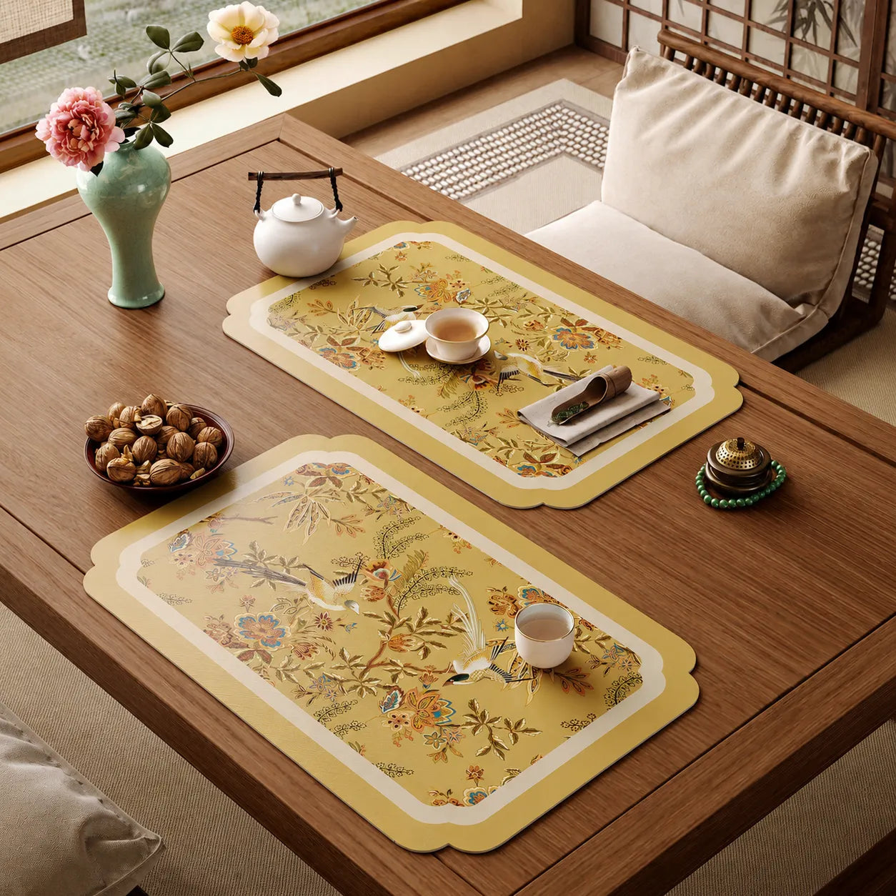 Two Autumn Splendor leather tea table mats styled with teaware in an elegant Eastern-inspired tea room.