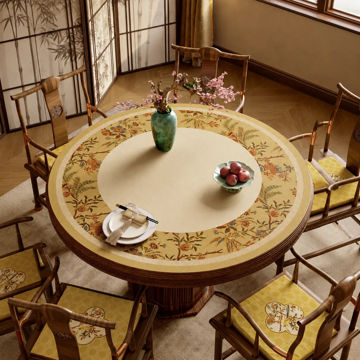 Autumn Splendor round leather dining table mat with golden Chinoiserie floral border on a traditional wooden round table.