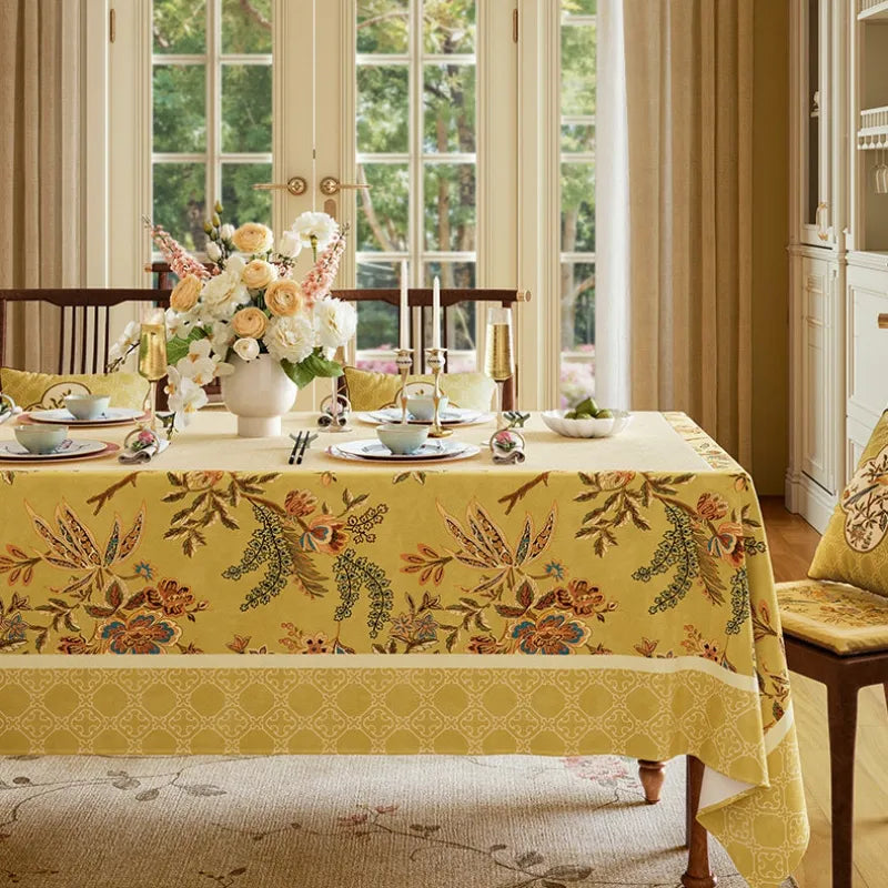Autumn Splendor yellow Chinoiserie tablecloth styled on a rectangular dining table for elegant family dinners, fall gatherings and seasonal home decor.