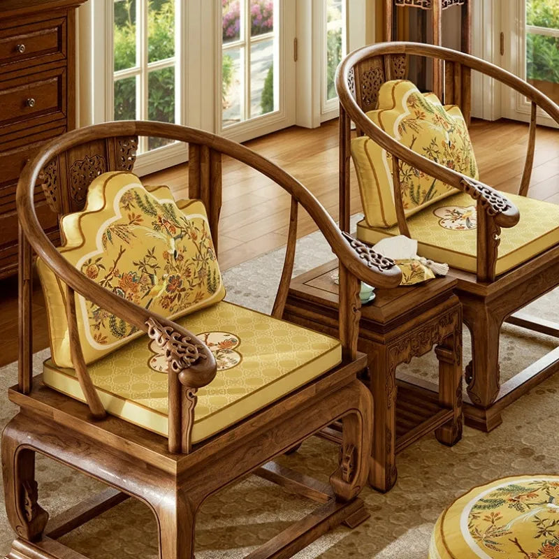 Pair of Autumn Splendor decorative lumbar pillows on traditional wooden chairs for coordinated Chinoiserie living room decor.