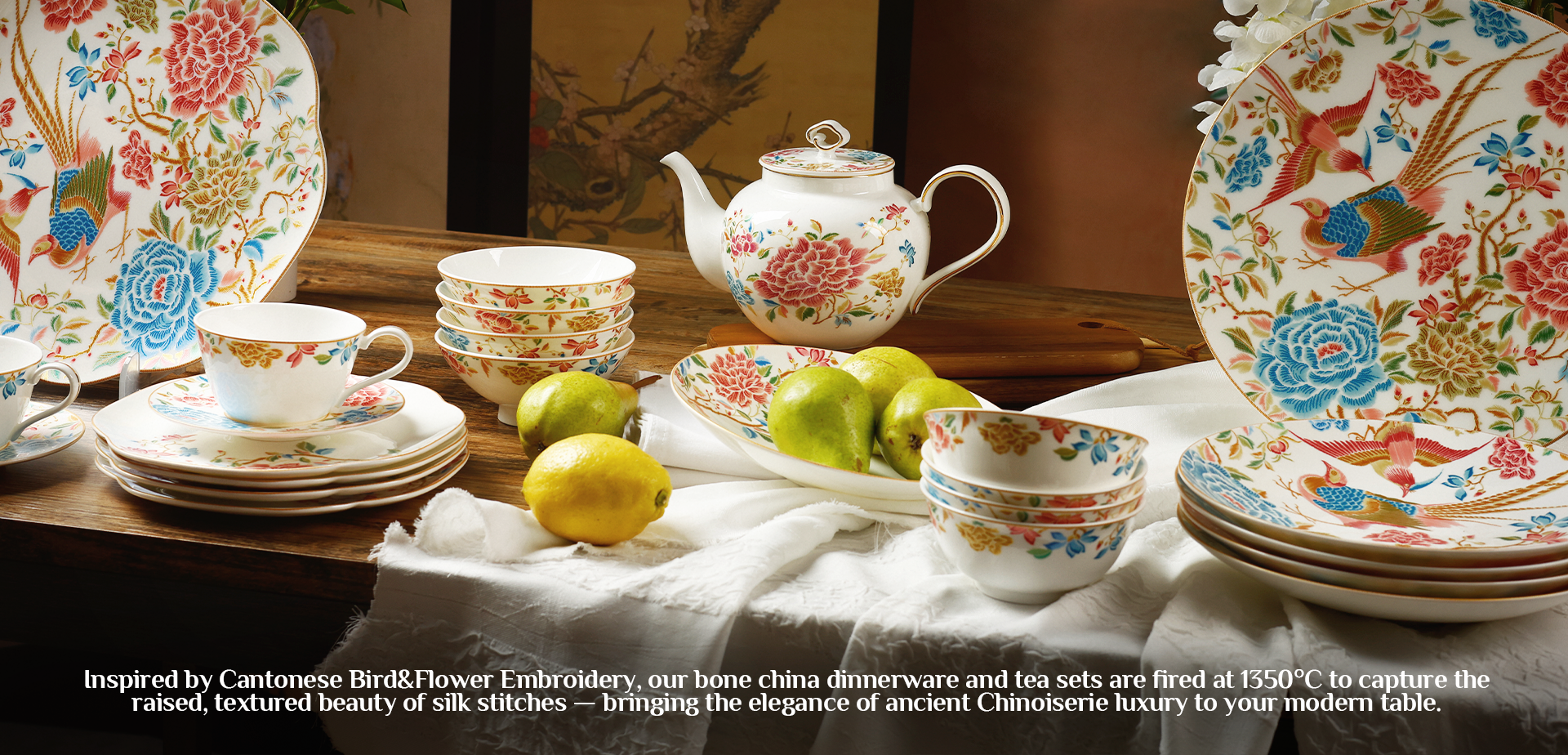 Luxury chinoiserie bone china dinnerware set with floral and bird motifs, including plates, teapot, and cups, arranged on an elegant table setting.
