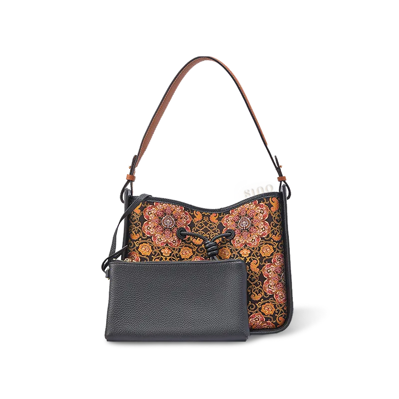 Luxury Dayun Brocade crossbody with pomegranate motif.