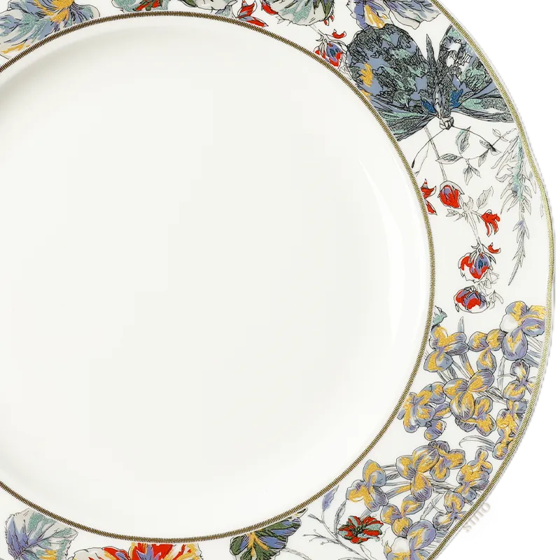 Hand-painted floral rim with minimalist center - luxury bone china close-up.