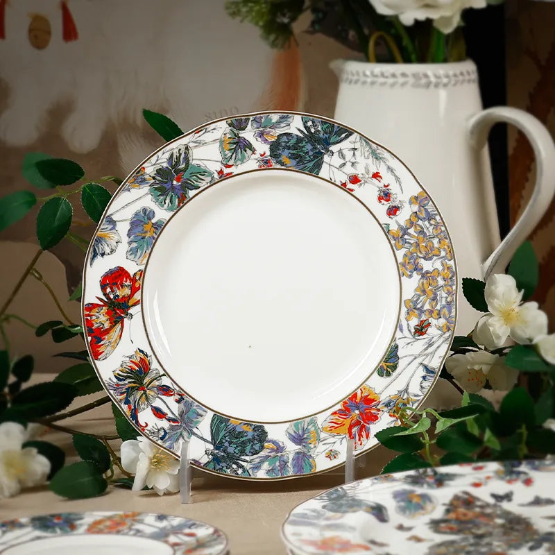 Vertical display: 8.75" chinoiserie bone china plate with flowers and elegant teapot.